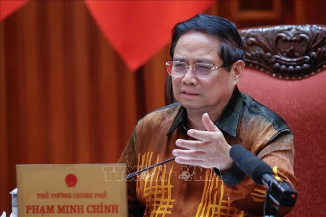 Thủ tướng Phạm Minh Ch&iacute;nh chủ tr&igrave; cuộc họp về Trung t&acirc;m t&agrave;i ch&iacute;nh quốc tế tại Việt Nam. Ảnh: Dương Giang/TTXVN