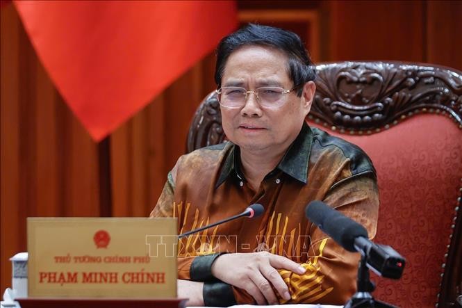 Thủ tướng Phạm Minh Ch&iacute;nh chủ tr&igrave; cuộc họp về Trung t&acirc;m t&agrave;i ch&iacute;nh quốc tế tại Việt Nam. Ảnh: Dương Giang/TTXVN