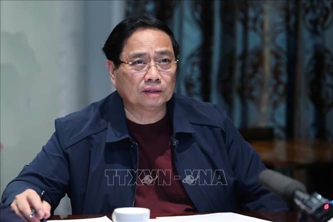 Thủ tướng họp khẩn trực tuyến từ Nam Phi về ứng ph&oacute; lũ lụt ở miền Trung. Ảnh: Dương Giang/TTXVN